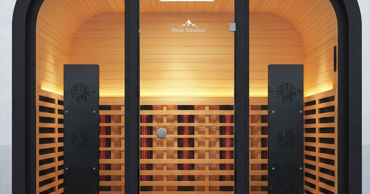 Sauna interior with two black panels flanking rows of glowing infrared heaters