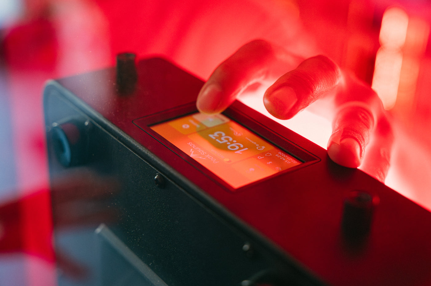 Adjusting the Peak Saunas touchscreen control under red light
